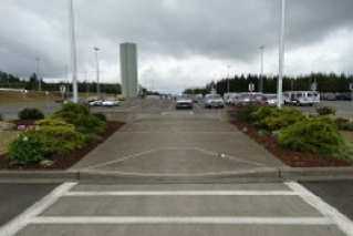 Running slope of ramp now 8.3°. Access way re-striped to align with new curb cut