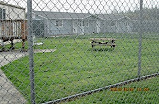 The picnic tables for the Extended Family Visit Units were not in an accessible path and were not an accessible design.