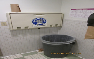 The changing station was 57" high when closed. The garbage can also blocked the path to the changing table.