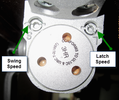 Picture of a door closer with the adjustment screws labeled for "Swing Speed' and "Latch Speed".
